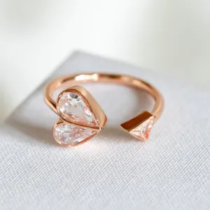 Rock solid stone heart twist rose gold ring (clear/ rose) Size: 7