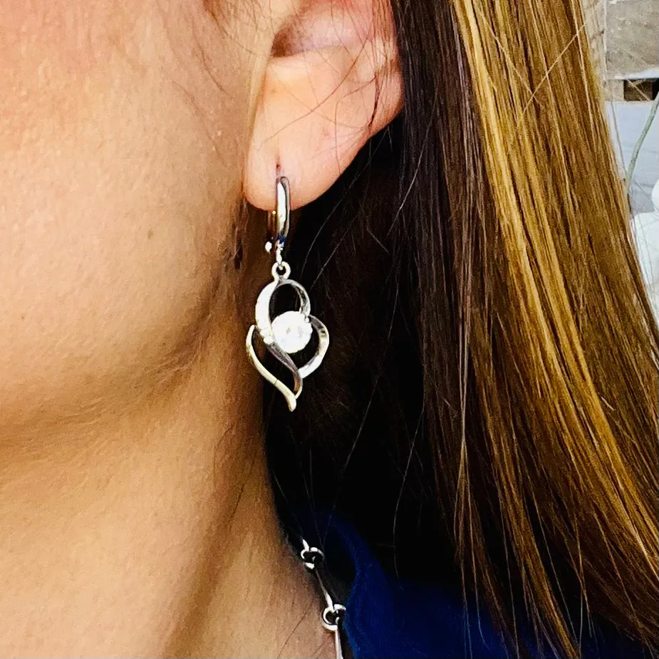 Sideways Dangling Zircon Heart Earrings